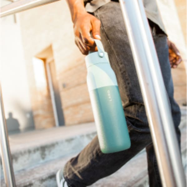 Photo of LARQ Bottle Swig Top - Eucalyptus green in hand on the move
